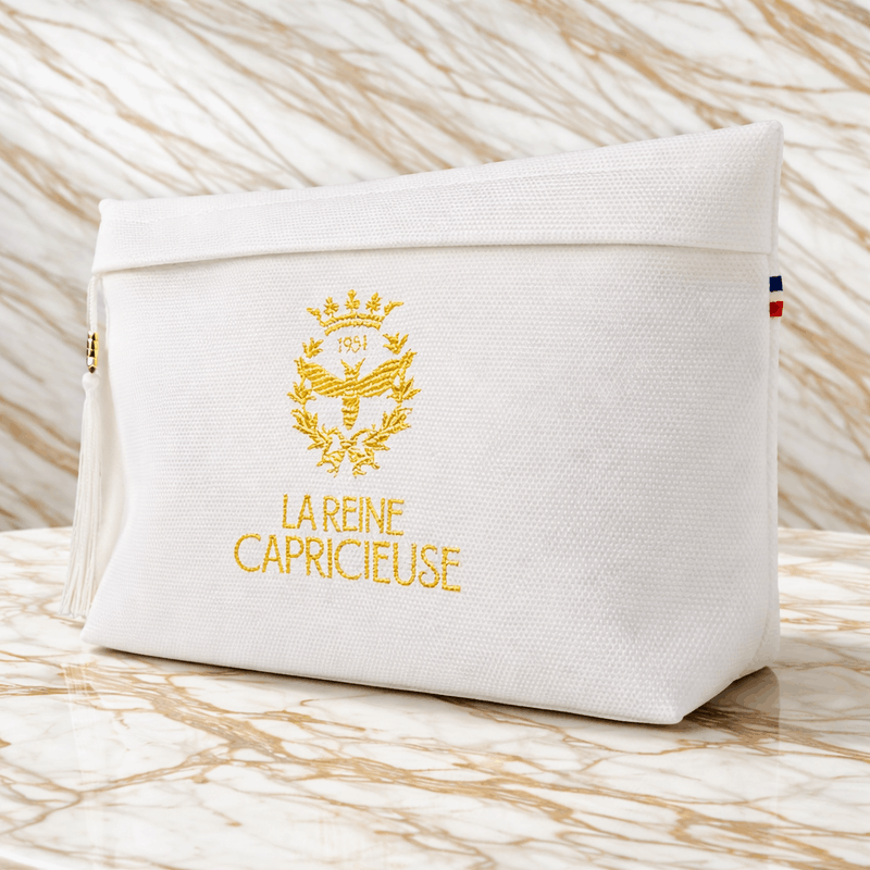 The opened Cellular Kit revealing the four signature skincare products of La Reine Capricieuse